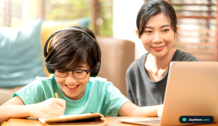 Cheerful asian child boy online lesson study from home concept with mom and dad