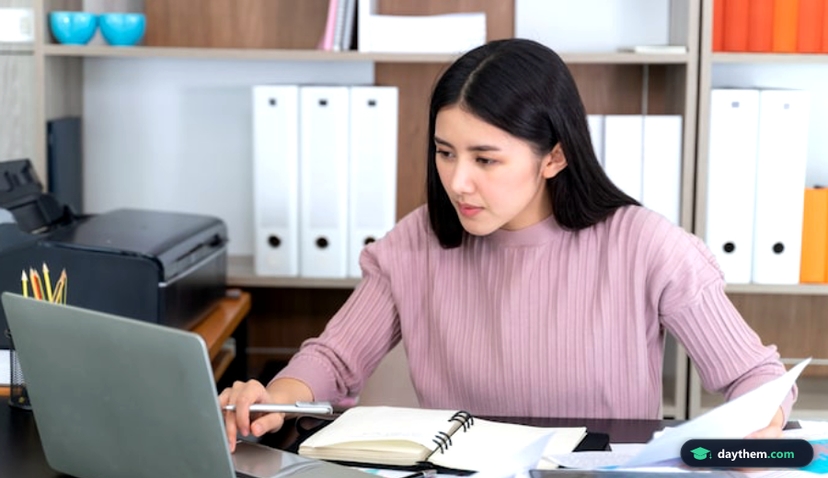 Young beautiful working with laptop on table in office