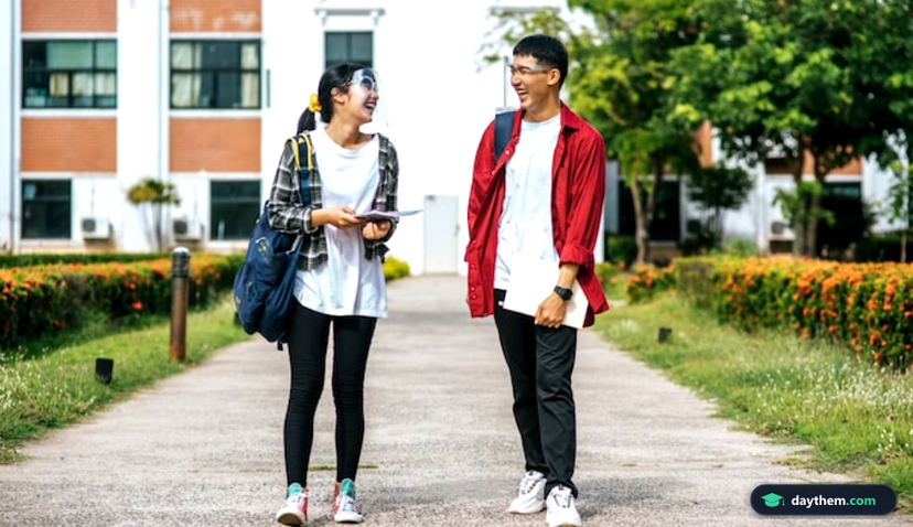 Male and female students wear a face Chill and stand in front of the university.